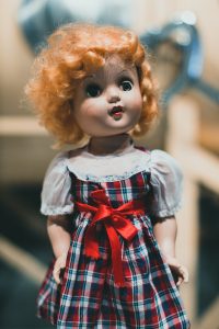Used to be Simpler: a close up of a doll with red hair